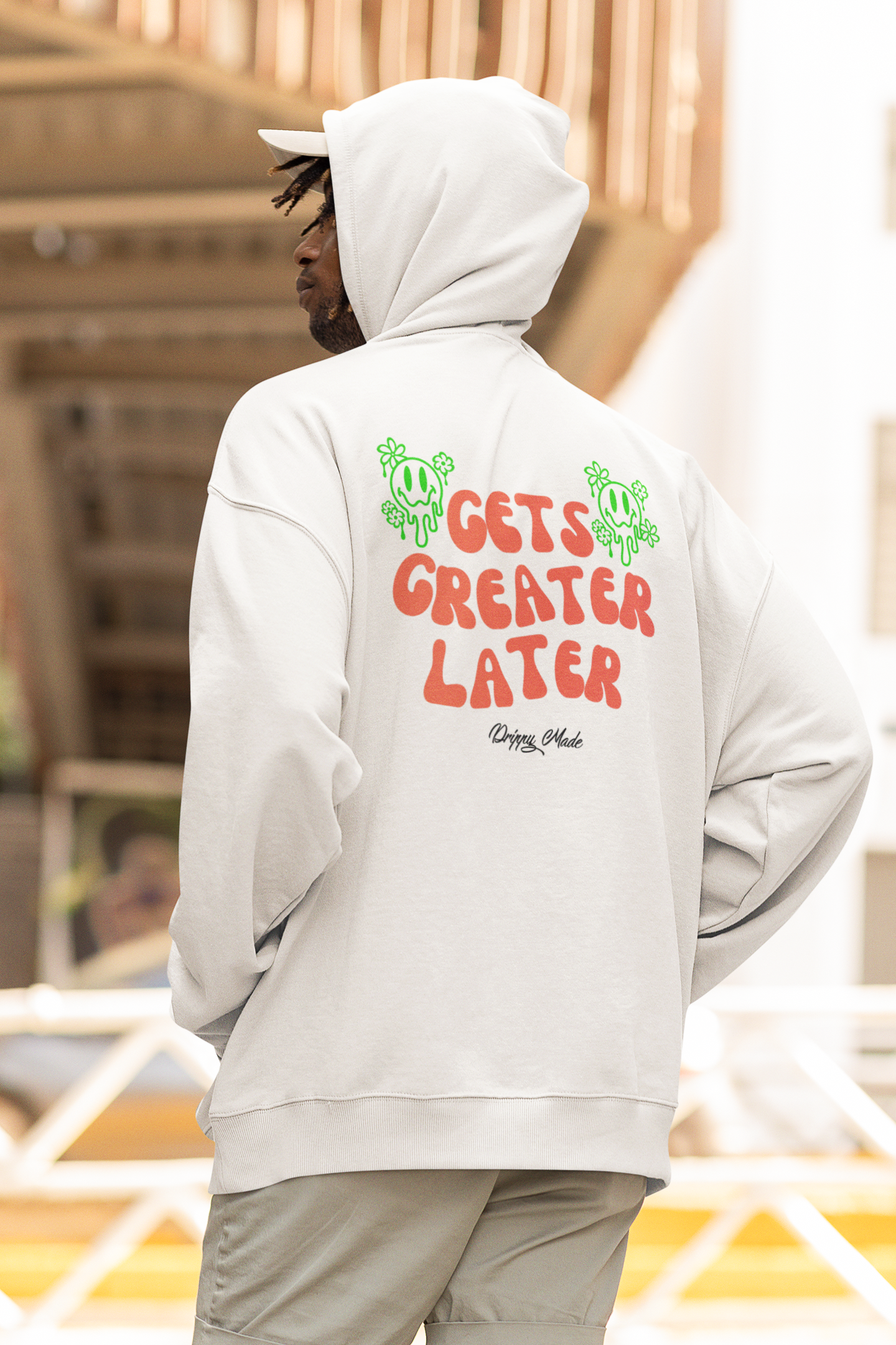 Man wearing a White Cream Gets Greater Later Hoodie