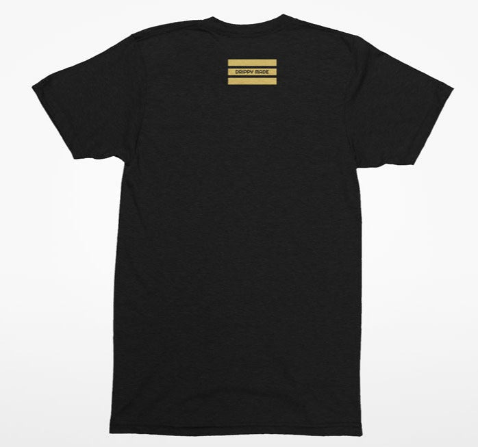 Back of black t-shirt with gold drippy made design on upper back